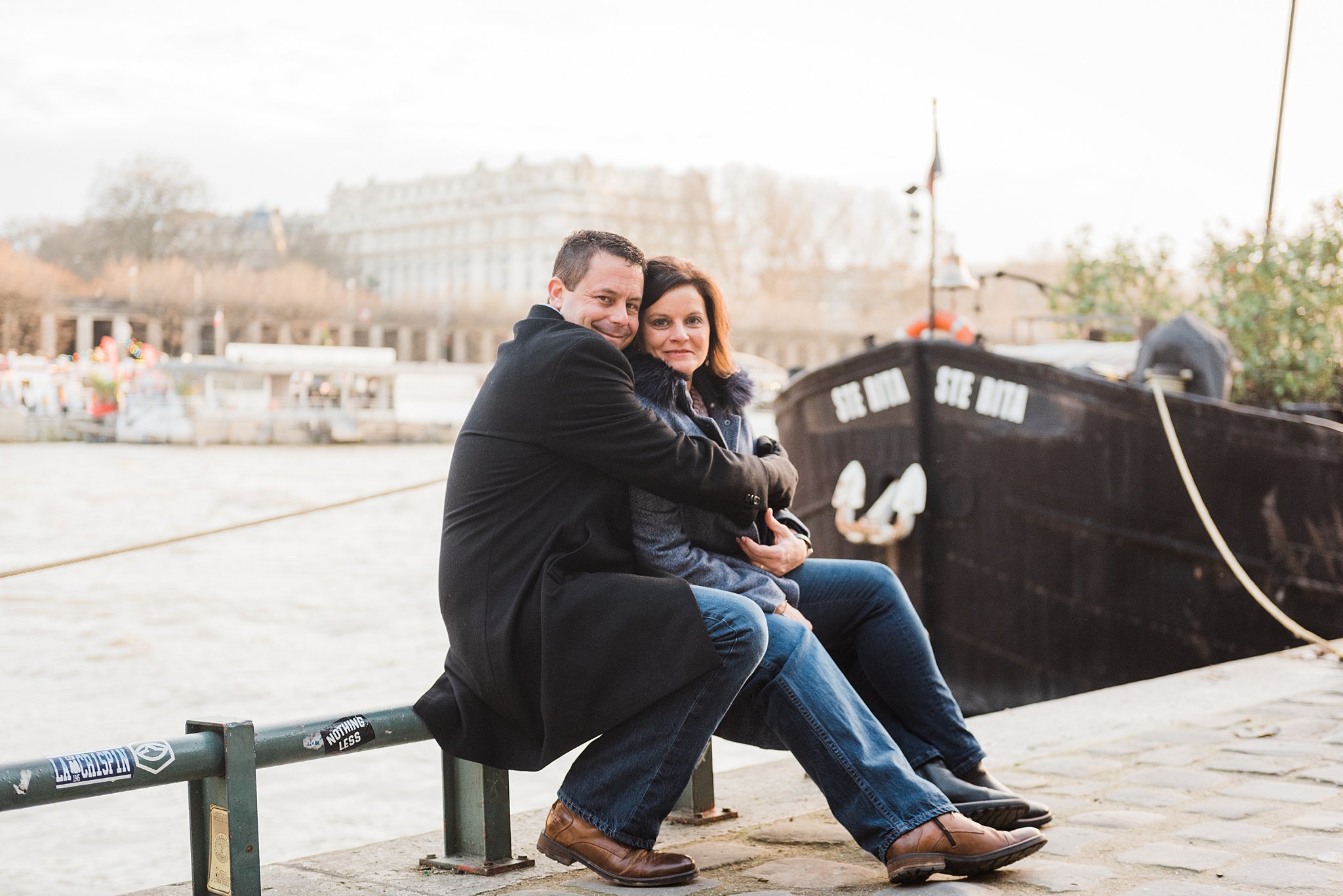 25th anniversary couples photography session by the seine river in Paris, France